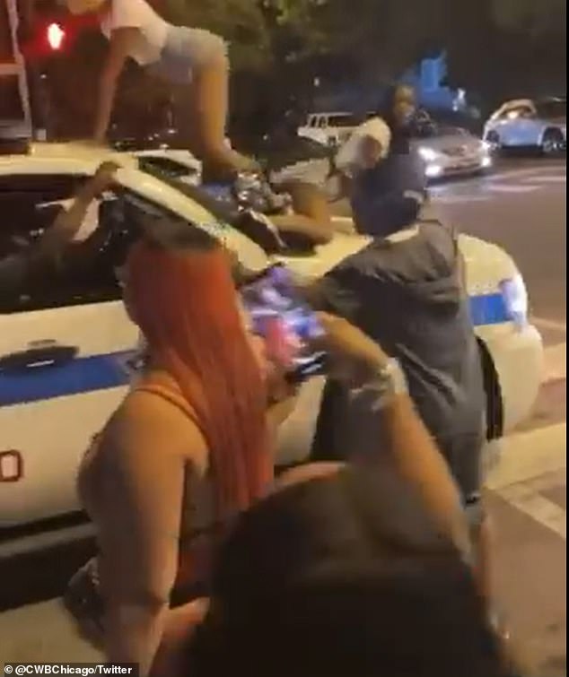 chicago women dancing on cop cars